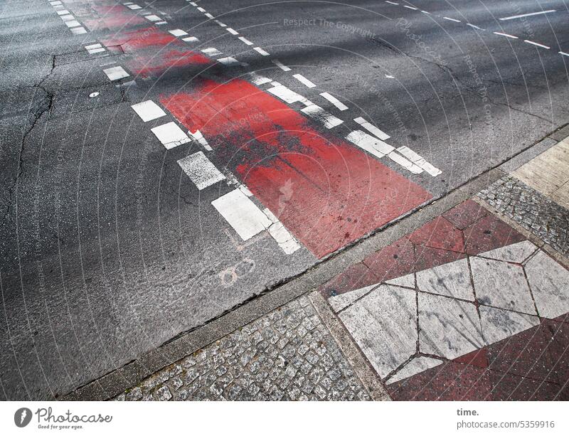 Frog perspective: unpleasant Street Crosswalk Cycle path curb Asphalt paving Red mark Stripe lines Dirty Wacky skid marks urban Road traffic