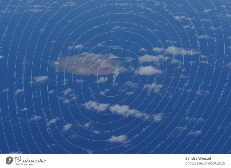 Canary island from the plane Clouds Airplane Flying Canaries Atlantic Ocean vacation Fuerteventura Sky travel CO2 emission Climate