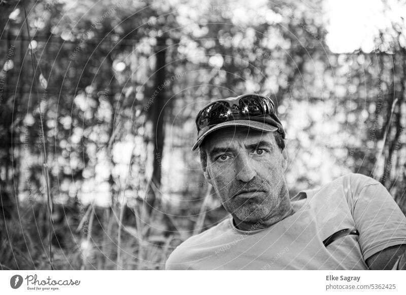 Serious men portrait black and white photo Young man Exterior shot Human being Shallow depth of field pretty Face Masculine Facial hair Looking into the camera