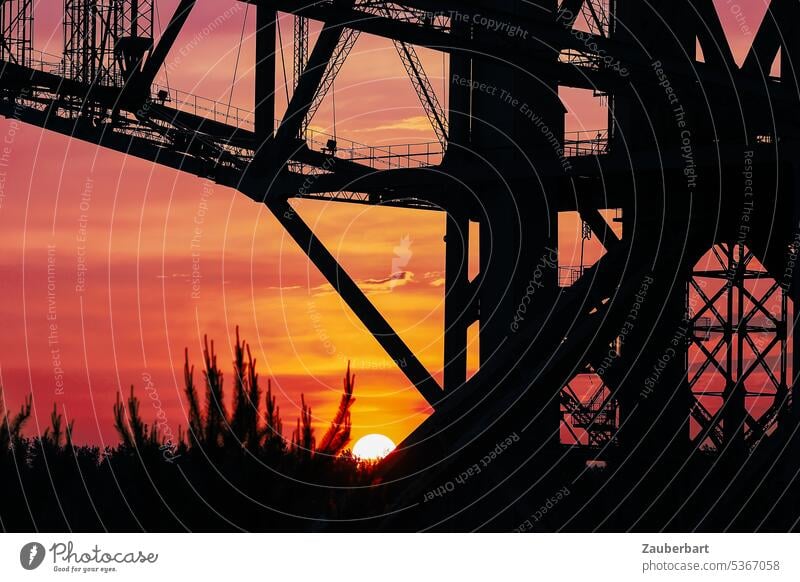 Sunset behind a conveyor bridge Overburden conveyor bridge f60 Industry Evening sun Industrial heritage Lignite Open pit mining overburden Energy industry