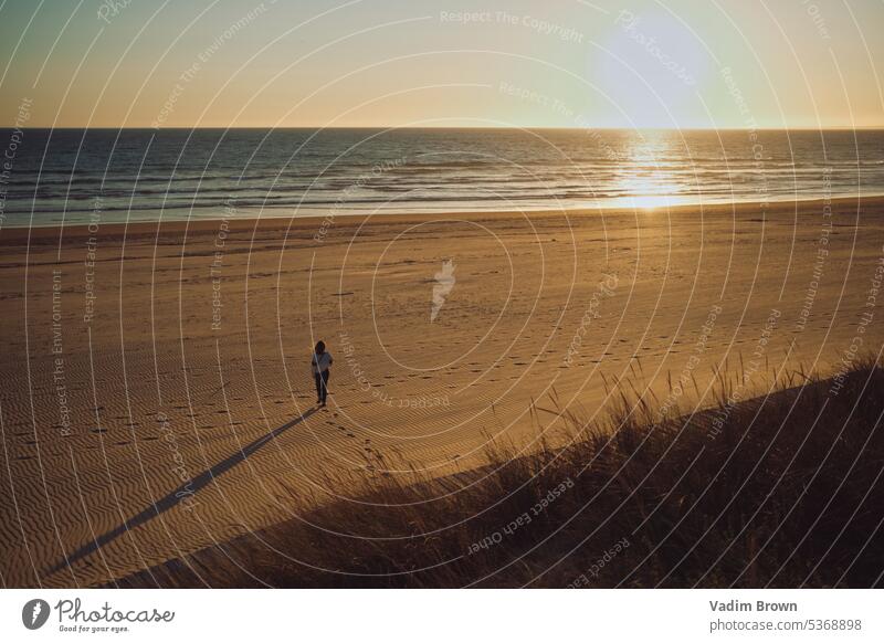 sunset on the beach sea ocean water sky sunrise sand waves landscape nature coast summer evening clouds island horizon orange color dusk shore travel alone