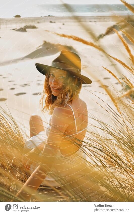 portrait of a woman in the hat beach girl sea summer vacation water beauty sun travel people ocean body sand leisure holiday fashion tropical lifestyle