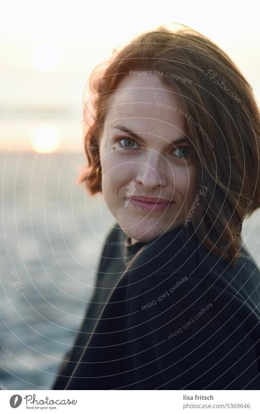 WOMAN - GRINNING ON BEACH - SUNLIGHT Woman 30-35 years Brunette Short-haired Feminine Colour photo Adults portrait Young woman Exterior shot