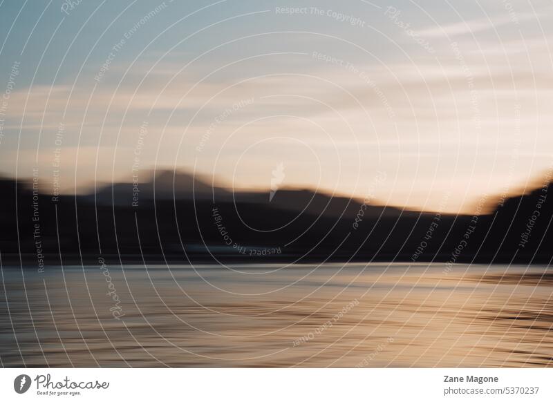 Abstract blurry mountain landscape by the sea, Spain spain mountains swimming water safety safety on water dreamy ocean waves Safety (feeling of) dizziness