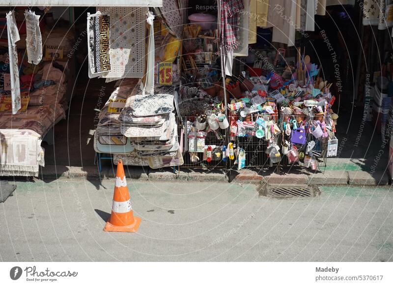 Colorful junk and home textiles with Lübeck hats in the summer sunshine at the market and bazaar in Adapazari in the province of Sakarya in Turkey Summer Town