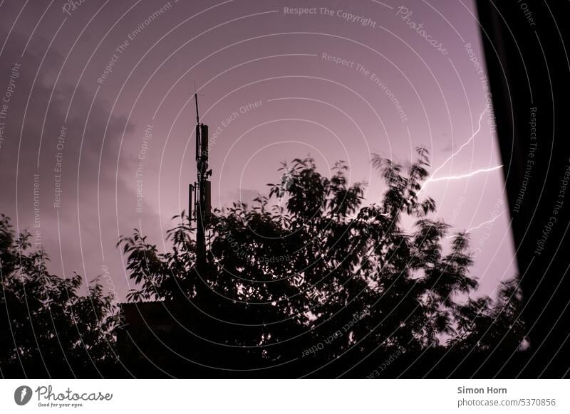 Night sky is lit up by a flash of lightning lightning bolt Discharge Violet Storm Thunder and lightning Lightning Threat Moody Light (Natural Phenomenon)