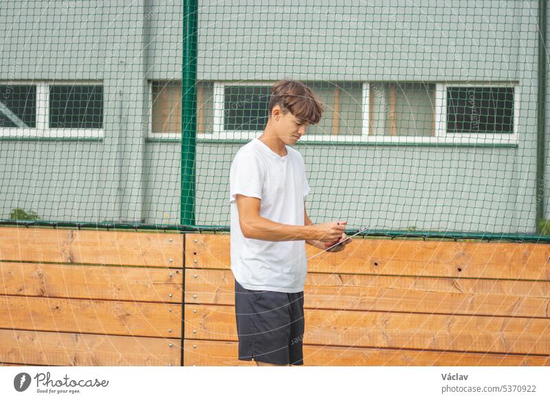 Young, ambitious coach instructs his players on what to do on the field. Coaching games from behind the line. Mentality and crisis preparedness briefing club