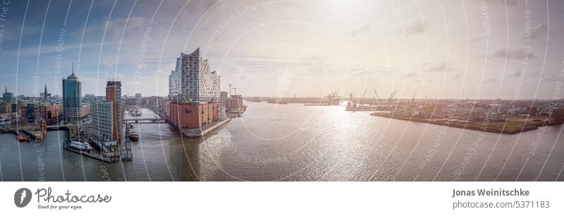 Panorama of the Hamburg skyline in the morning architecture blue bridge building business city cityscape complex concert concert hall construction crane