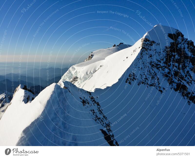 tightrope walk Peak ridge Mountain Landscape Snowcapped peak Hut Alpine hut Alps Exterior shot Deserted Nature Colour photo Rock Cold Day Mountaineering Glacier