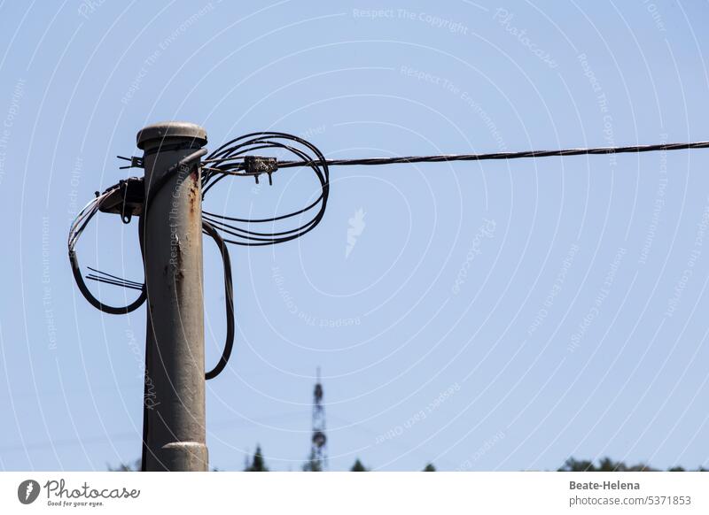 Heavenly cohesion Sky Blue clear Metal post Wire Attachment dilapidated brittle Wire cable Landscape Clamp Rust Deserted Colour photo Exterior shot Detail