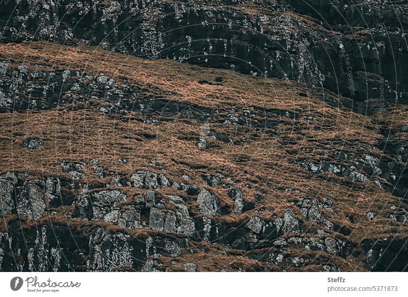 overgrown rocky hill on the Faroe Island of Streymoy färöer Rock mound Hill side Faroe Islands Basalt rock formation basaltic ancient Sheep Islands Geology