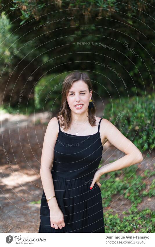 Woman in nature wearing a black dress Portrait photograph portrait portrait of a woman Young woman Hair and hairstyles Face of a woman Feminine