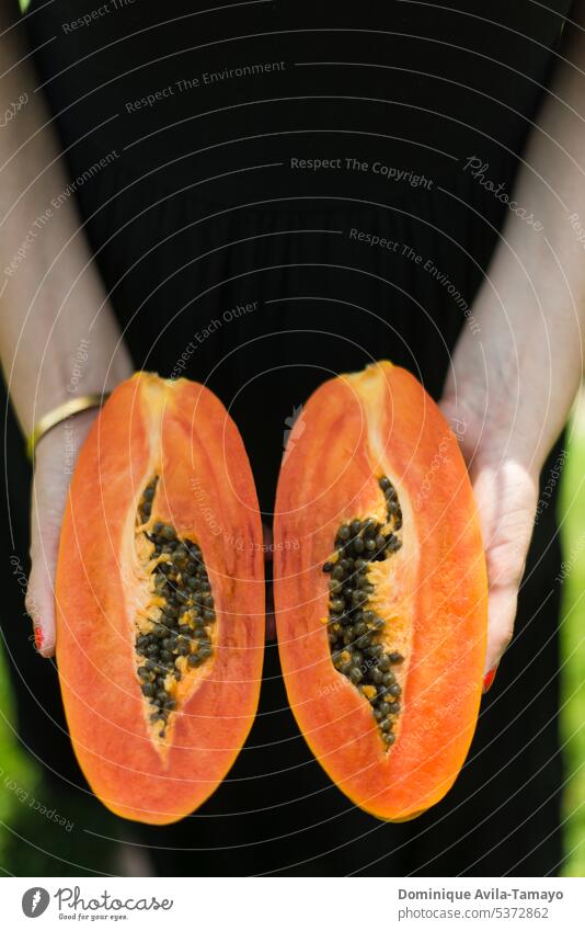 Hands holding sliced papaya fruit Papaya hands Lifestyle Healthy Eating food sweet exotic healthy vitamin organic tropical Nutrition Delicious Summer vegetarian