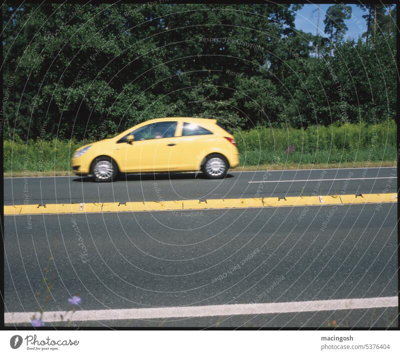 Country road with yellow median and yellow car Exterior shot Trip Yellow Colour photo Vacation & Travel Tourism Day Landscape Summer Nature Summer vacation