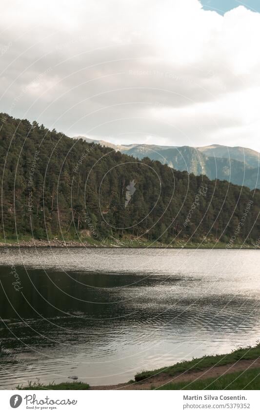 Engolasters lake in the in the Pyrenees in Andorra. andorra background beautiful blue cloudy cold destination encamp engolasters engordany environment escaldes