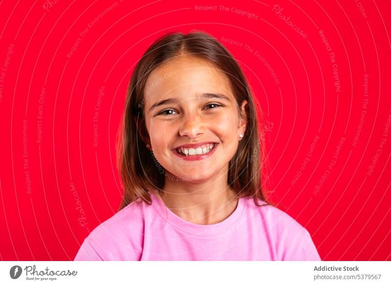 Cheerful teenager smiling and looking at camera girl smile positive portrait cheerful happy appearance casual joy glad friendly bright young adolescent optimist