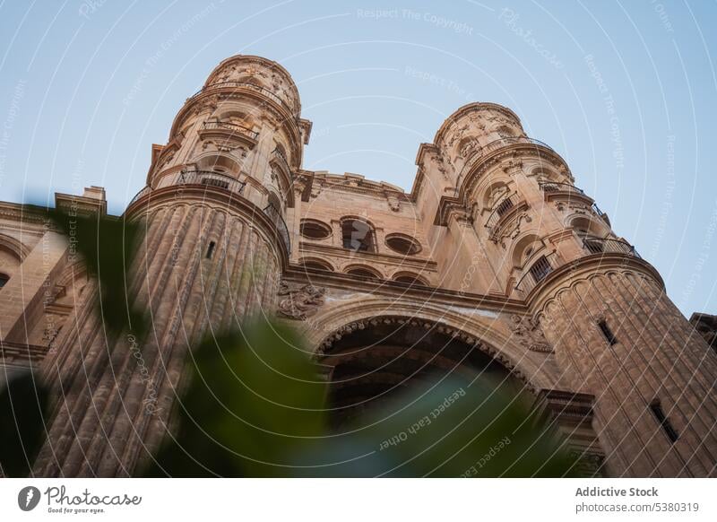 Old facade of cathedral with columns exterior architecture heritage historic sightseeing roman catholic malaga spain arched culture city construction medieval