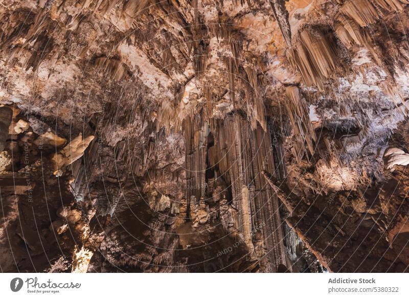 Ceiling of cave with stalactites highland formation rock geology mineral nature stone erosion ravine rough malaga spain landscape ridge terrain uneven untouched