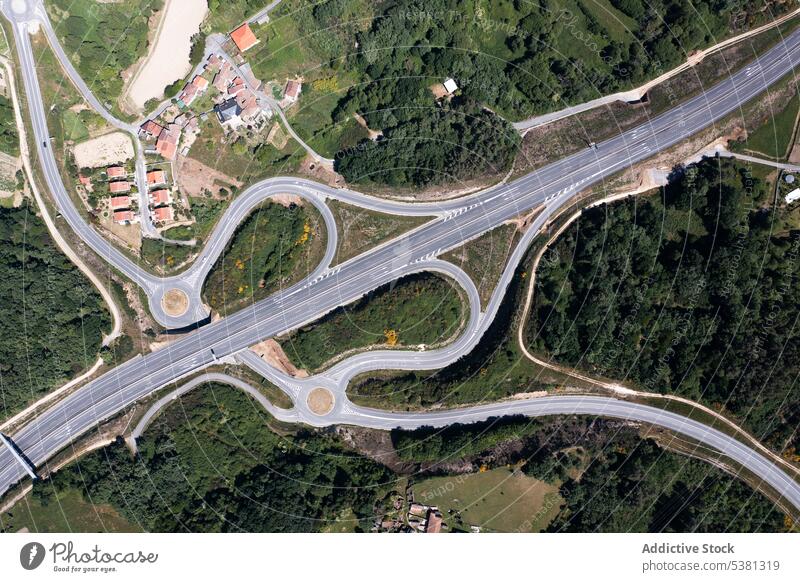 Drone view of big roads and parked vehicles picturesque infrastructure transport parking construction tree journey travel automobile summer daytime car ring