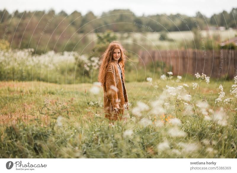 Redhead girl on the flowers field Smiling pretty long hairs naturally Model Girl portrait redhead youthful Natural color Flower Beauty & Beauty Healthy Face