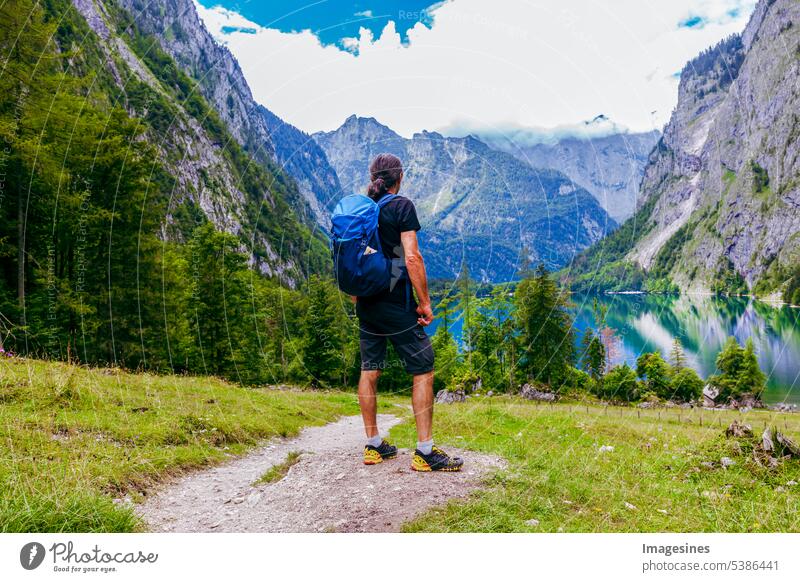 Backpacker. Man hikes. beautiful Bavarian landscape behind and between Königsee and Obersee, Schönau am Königssee. backpacker Hiking beautifully Landscape