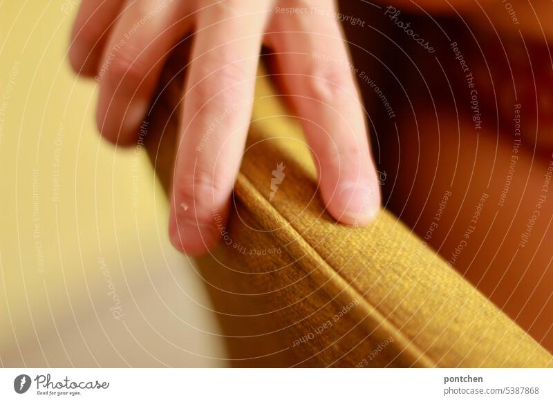 one hand on a chair back. woman sitting in chair Testing & Control Door handle Skin Shallow depth of field Interior shot Touch Close-up stop To hold on