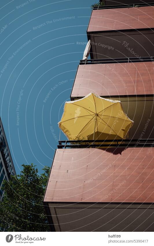 yellow parasol on balcony of skyscraper against blue sky - it's hot Sunshade Yellow Balcony glistening light Summer Sky Sunlight Worm's-eye view Blue