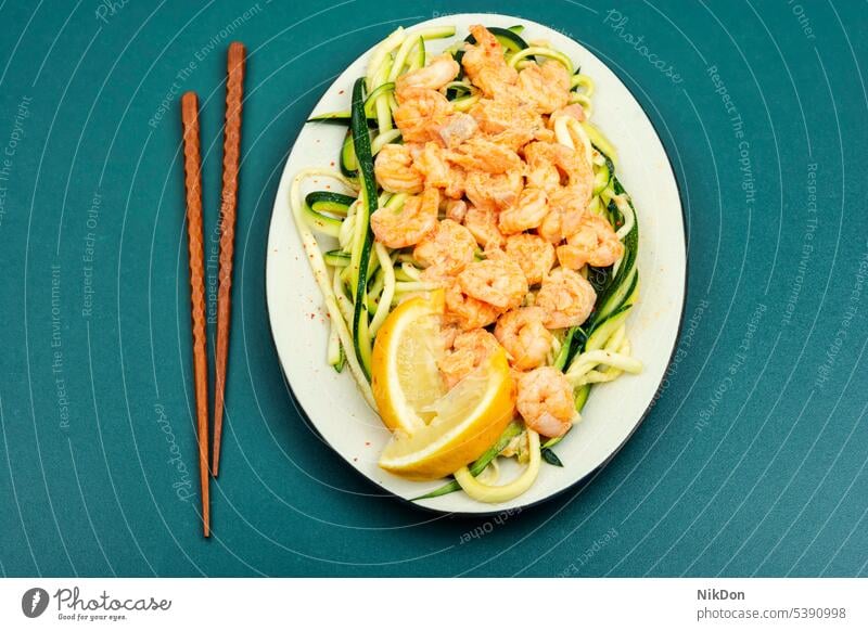 Shrimp with vegetable garnish. shrimp prawn fzucchini food seafood healthy plate cooking appetizer asian fried tasty chopsticks diet cooked lemon salad