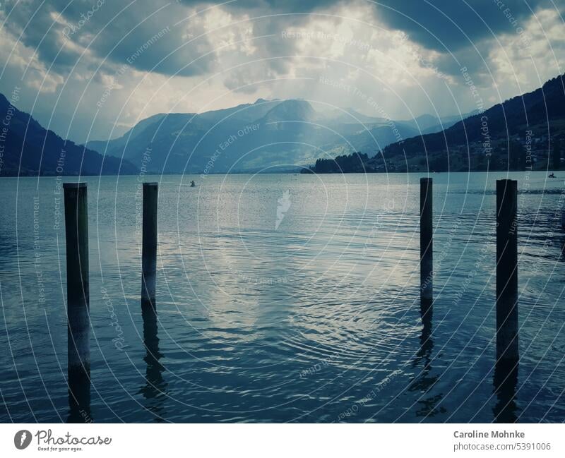 Sunlight shines through the clouds on Lake Sarnen Switzerland Nature Landscape Exterior shot Colour photo Deserted Day Environment Wide angle naturally Mountain