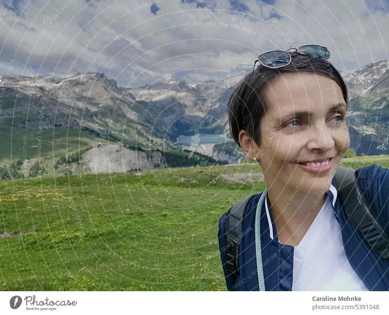 Woman in the mountains Reservoir Mountain Landscape Nature Exterior shot Lake Water Alps Sky Colour photo Peak Beautiful weather Environment Snowcapped peak Day