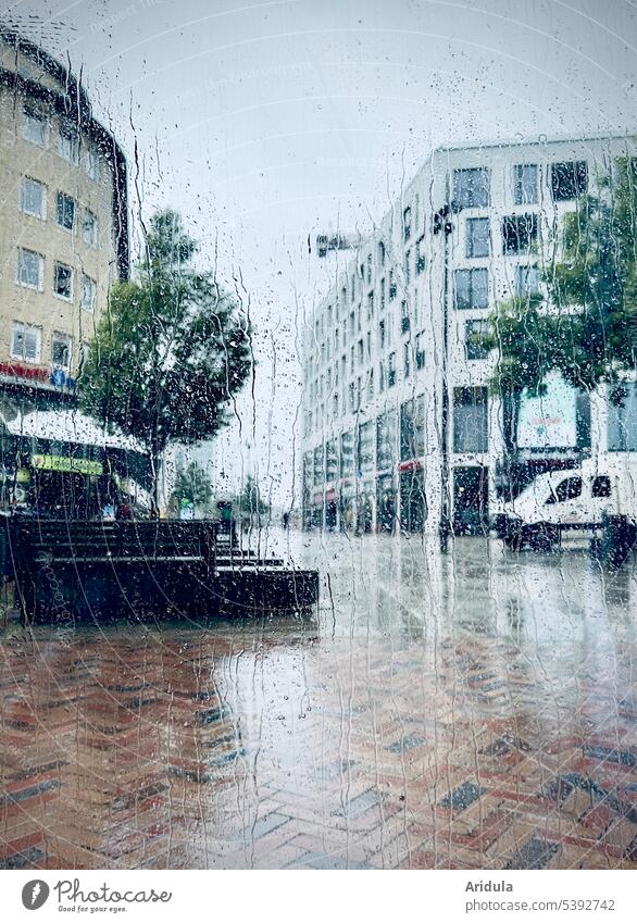 View through the window pane | Altona in the rain Rain raindrops Window pane Town Pedestrian precinct Wet Bad weather Drops of water Rainy weather houses car