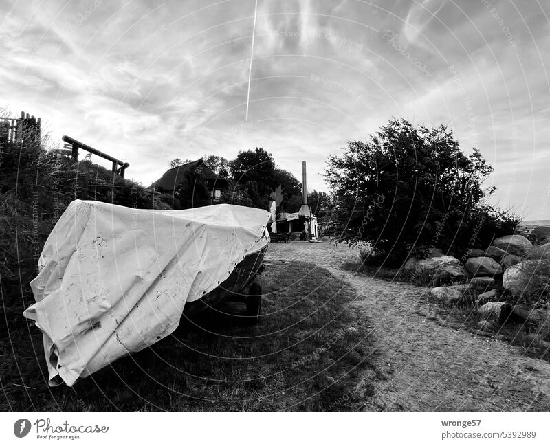 Vitt white Rügen Fishing village Fish smokehouse Fishing boat covered tarpaulin along the bank Beach coast Baltic Sea Vacation & Travel