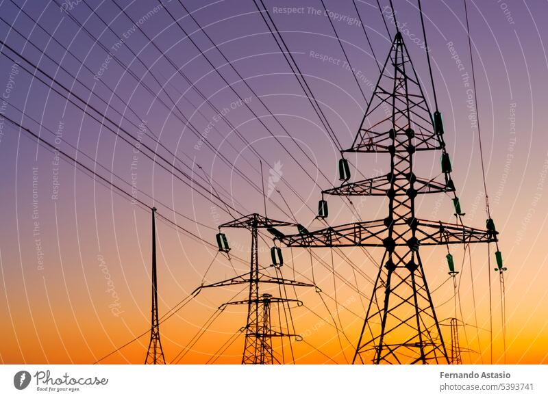 High voltage tower. High voltage. Electricity transmission power lines at sunset (high voltage pylon). High voltage circuit breaker in a power substation. Aerial view of high voltage power lines.