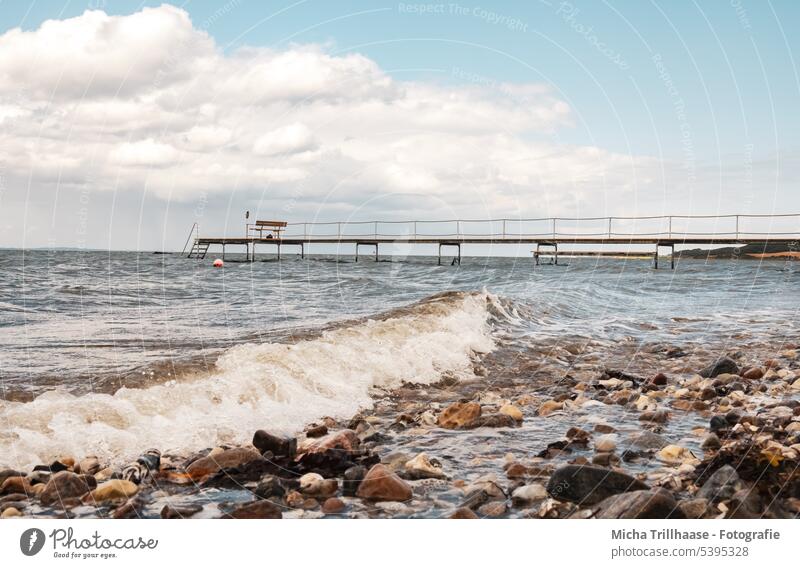 Jetty and waves on the Baltic Sea Denmark Langeland Tranekær Ocean Footbridge Bridge stones bank coast Landscape Nature Sky Clouds sunshine vacation Tourism