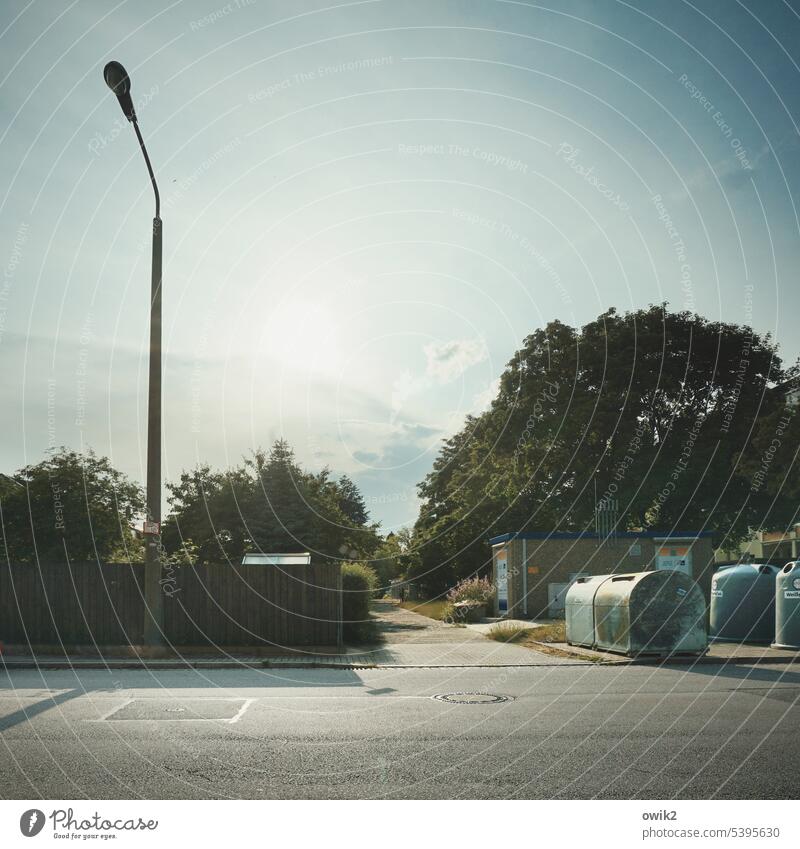 South Suburb dreariness trees Street Container Lantern Sky cirrostratus clouds Sun Back-light Lonely urban silent Boredom Copy Space top Copy Space bottom