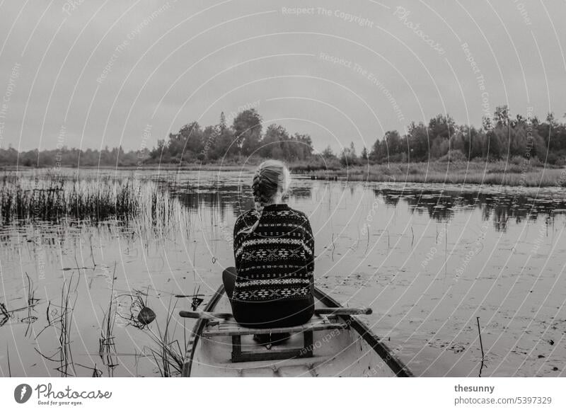 Woman in a canoe Canoe Canoe trip Lake Lakeside Navigation Swede plaited hair lake landscape Seaweed outlook enjoying the view tranquillity Peace silent