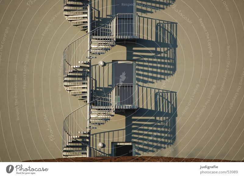 spiral staircase duo Winding staircase Round Downward Building Light Evening sun 2 Construction Emergency exit Entrance Way out Detail Stairs Metal Above Upward