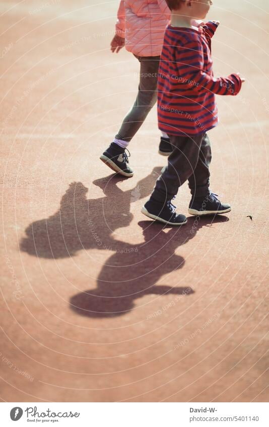 Children with shadow - together children Shadow at the same time Friendship Brothers and sisters Infancy Girl Boy (child) Sister stroll