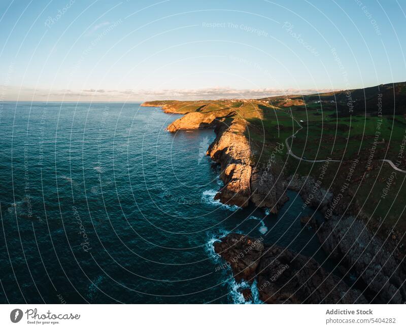 Picturesque view of rocky cliff and sea against sky mountain nature landscape picturesque scenic ocean cantabria spain scenery water idyllic blue sky shore