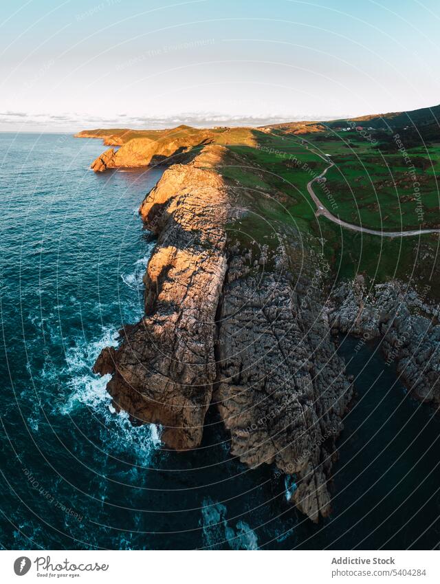 Picturesque view of rocky cliff and sea against sky mountain nature landscape picturesque scenic ocean cantabria spain scenery water idyllic blue sky shore