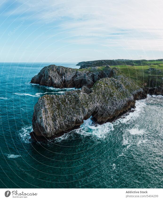 Picturesque view of rocky cliff and sea against sky mountain nature landscape picturesque scenic ocean cantabria spain scenery cloudy water idyllic shore