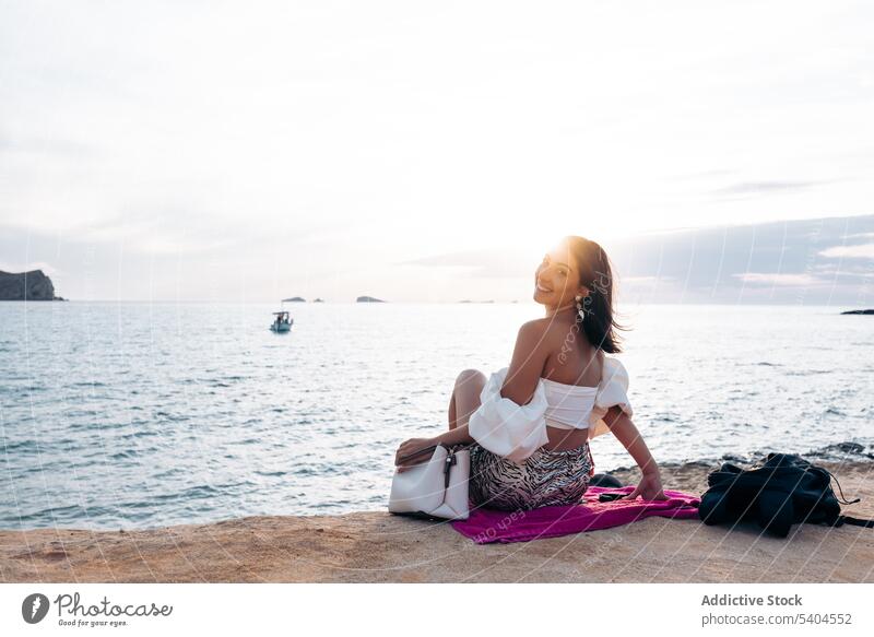 Woman chilling on sandy beach woman wavy sea summer vacation smile female balearic islands tourism travel seascape ocean coast shore water ripple exotic trip