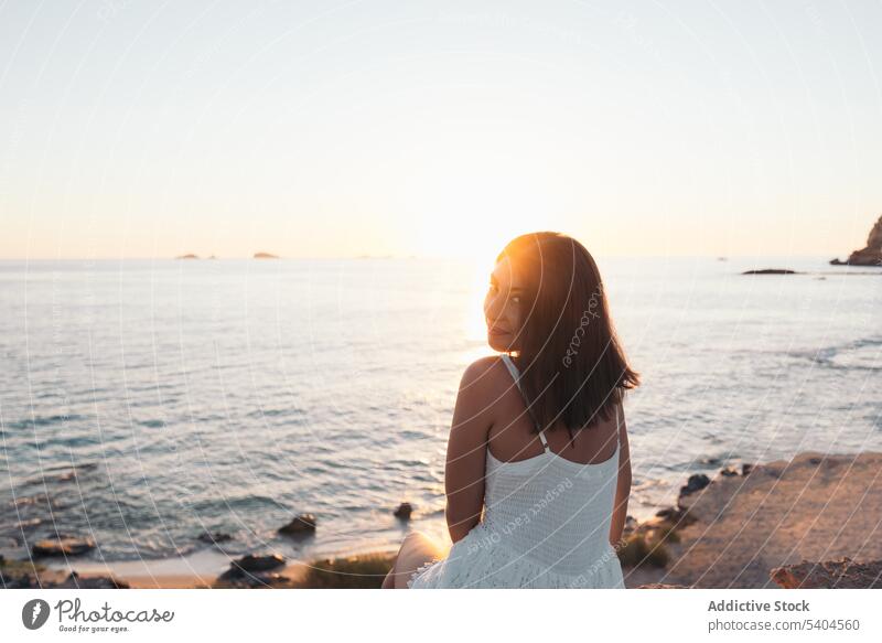 Woman relaxing on sandy beach woman wavy sea summer vacation smile female balearic islands tourism travel seascape ocean coast shore water ripple exotic