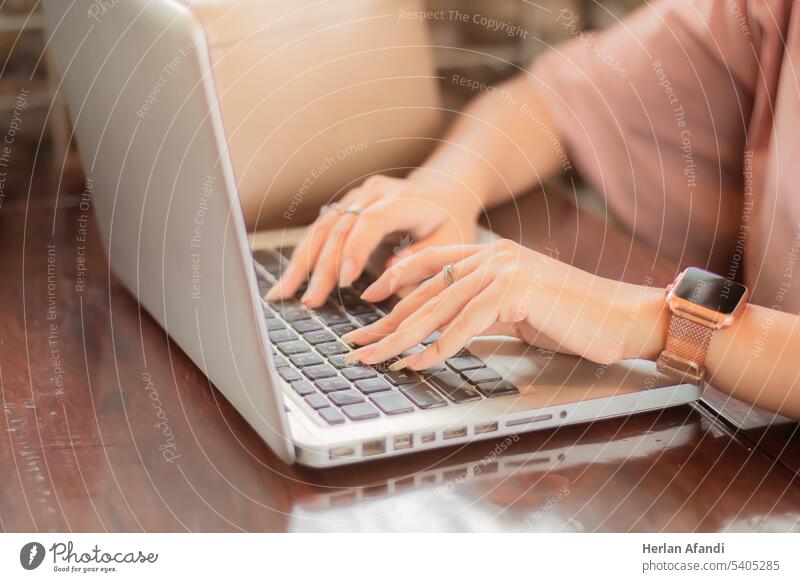 Hands close up of businesswoman working on laptop on table in cafe young beautiful technology modern girl adult hand internet computer communication online