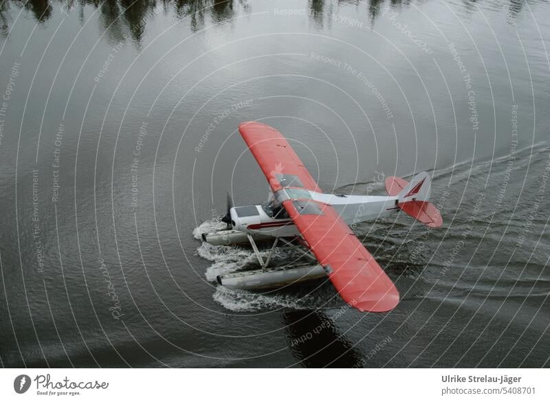 Alaska | bush pilot | a seaplane landing Seaplane Airplane Bush Pilot WATER LANDING Water Wings Red red wings reflection Tree reflection Adventure adventurous