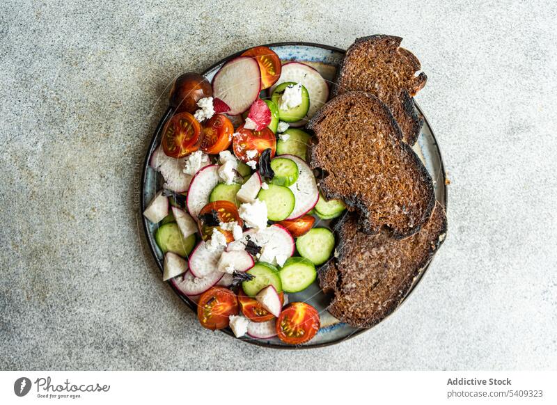 Vegetable salad with toast vegetable bowl radish tomato spice green feta cheese healthy food plate organic composition diet eat vegetarian mix slice fresh