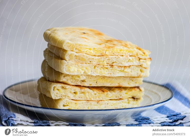 Traditional dish of Georgian imeruli khachapuri bread food sulguni cheese sweet delicious tasty yummy stack plate organic breakfast serve appetizing portion