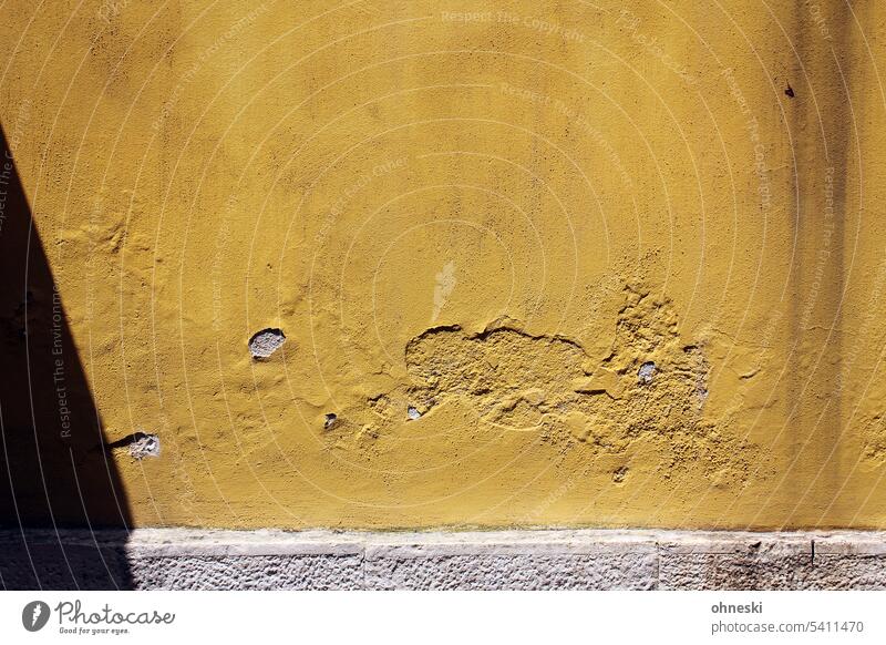 Yellow facade in sunlight Facade Old Wall (building) Colour photo Old town Architecture Building Exterior shot Wall (barrier) Plaster Broken Decline Transience