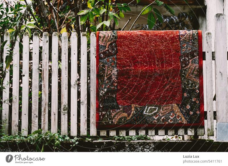 A colorful carpet hangs over the fence... Carpet variegated Living or residing Garden Fence Garden fence Green urban Summer Summery Design airing out Ventilate