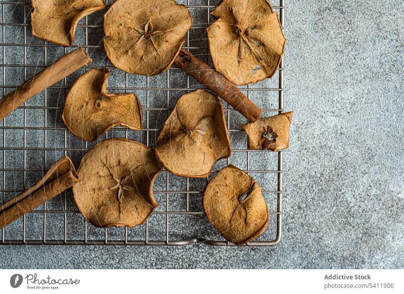 Slices of dried apples on oven tray slice fruit high angle from above blur blurred background many taste tasty yummy delicious healthy nutrient nutrition